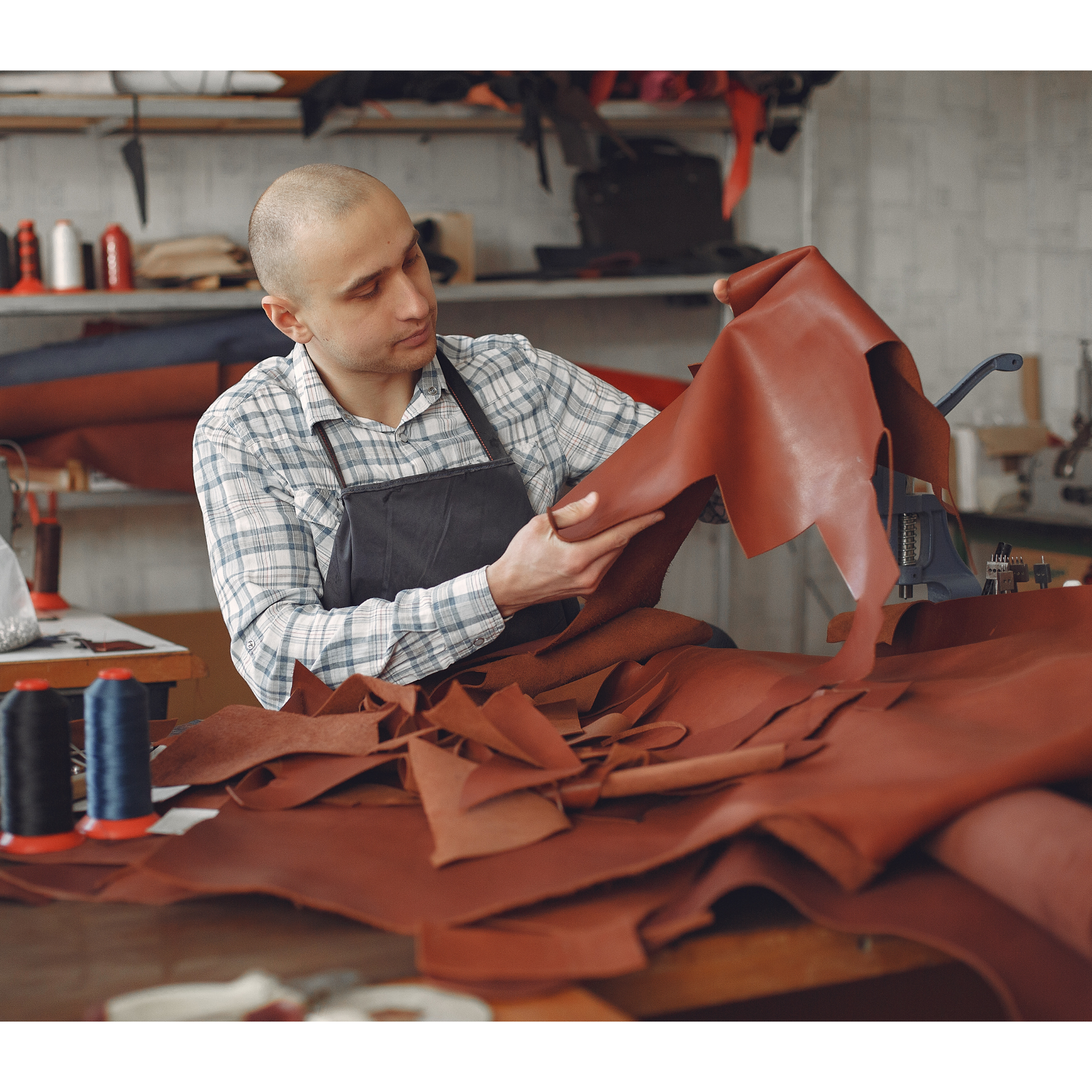 Man working with leather in a workshop